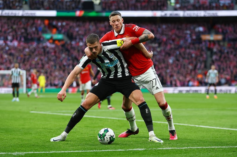 Newcastle United's Sven Botman in action with Manchester United's Wout Weghorst. Reuters