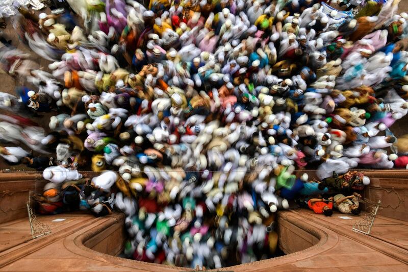 Indian Muslims leave after offering Eid al Fitr prayers at the Jama Masjid mosque in New Delhi. Alaa Al-Marjani / Reuters