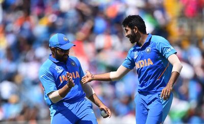 LEEDS, ENGLAND - JULY 06: Jasprit Bumrah high fives Rohit Sharma of India after he gets Angelo Matthews of Sri Lanka out during the Group Stage match of the ICC Cricket World Cup 2019 between Sri Lanka and India at Headingley on July 06, 2019 in Leeds, England. (Photo by Nathan Stirk/Getty Images)