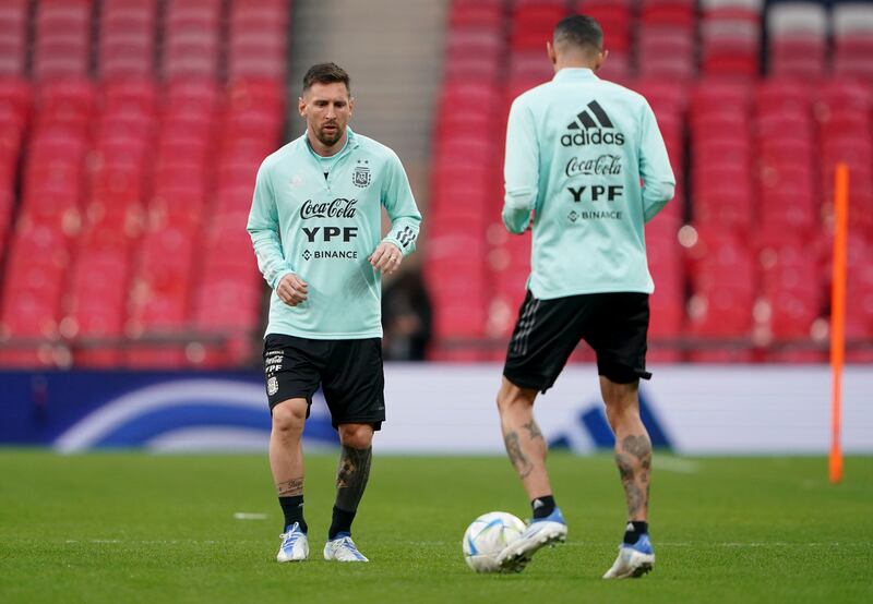 Argentina's Lionel Messi, left, takes part in a training session at Wembley Stadium. AP