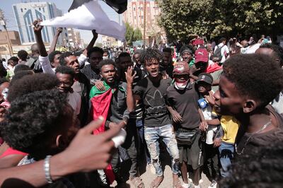 People chant slogans during a protest against last year’s military takeover in Khartoum, Sudan. AP