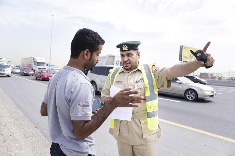 First Lieutenant, Essa Ahmed helps a man, who stopped to ask for directions