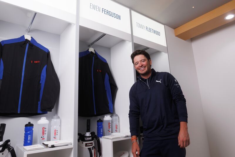 Ewen Ferguson of Scotland poses for a portrait next to his locker in the Great Britain and Ireland locker room. Getty Images