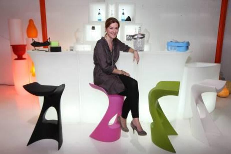 DUBAI, UNITED ARAB EMIRATES Ð May 30, 2011: Claudia Van Der Werf owner of the Desert River sitting on the Koncord Bar Stool at the Desert River warehouse in Al Quoz Industrial Area in Dubai. (Pawan Singh / The National) For House & Home