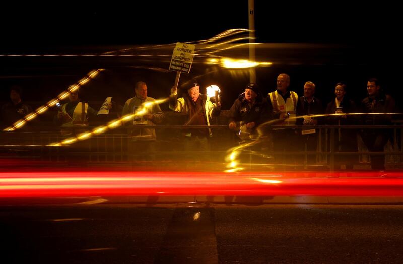 Demonstrators hold a candlelit vigil on the border between Ireland's Donegal county and Londonderry county in Northern Ireland in Lifford, Ireland.  Reuters