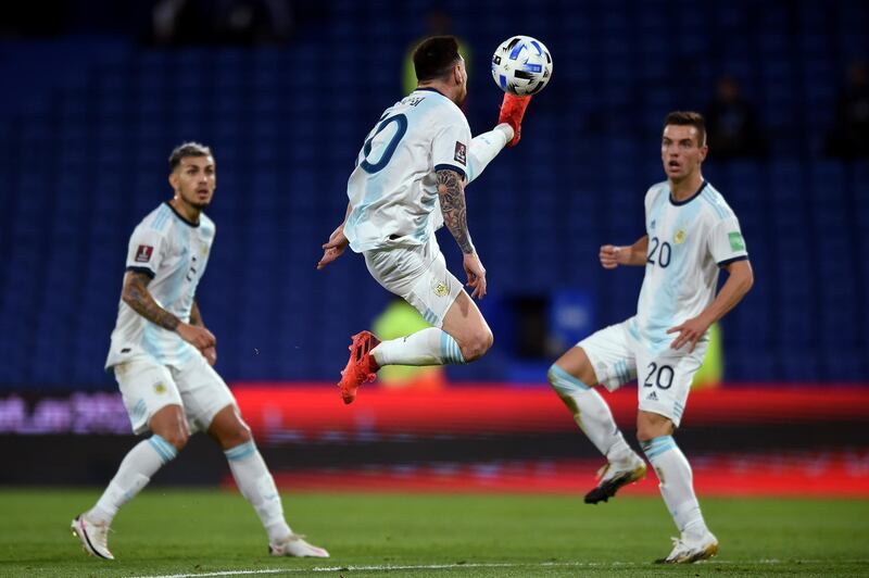 Argentina's Lionel Messi, centre, in action against Paraguay. EPA