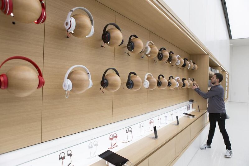 Headphones on display at the Apple Store in Mall of the Emirates in Dubai. Reem Mohammed / The National