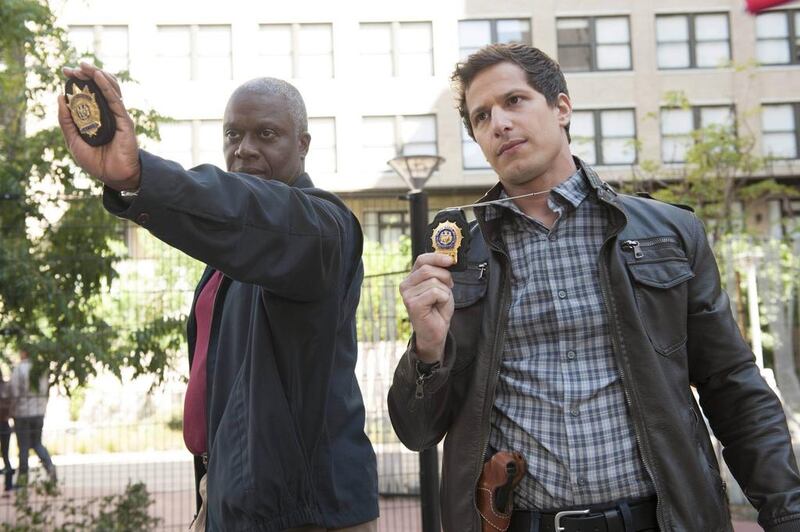 Capt. Ray Holt (Andre Braugher, left) and Det. Jake Peralta (Andy Samberg, right) chase down a graffiti tagger in the all-new The Tagger episode of Brooklyn Nine Nine. Eddy Chen / FOX