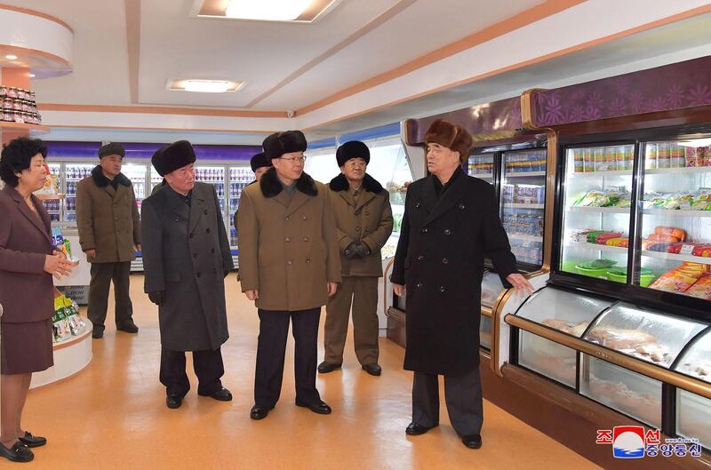 North Korea's party and government officials inspecting stuffed fridges in a supermarket during a ribbon-cutting ceremony to open a Township of Samjiyon County. North Korea's leader Kim Jong Un attended the ceremony.  EPA
