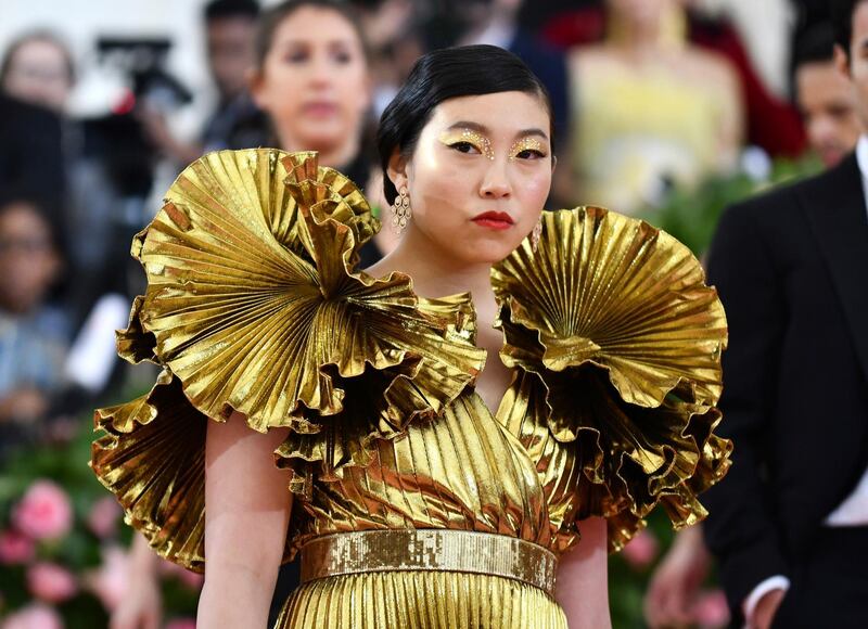 Rapper and actress Awkwafina mirrored her golden gown with Midas-worthy eyeshadow, delicately dotted with gemstones. AP