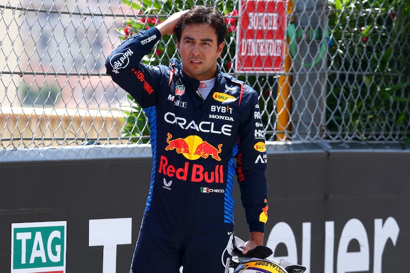 Sergio Perez of Mexico and Red Bull Racing looks on after crashing. Getty Images