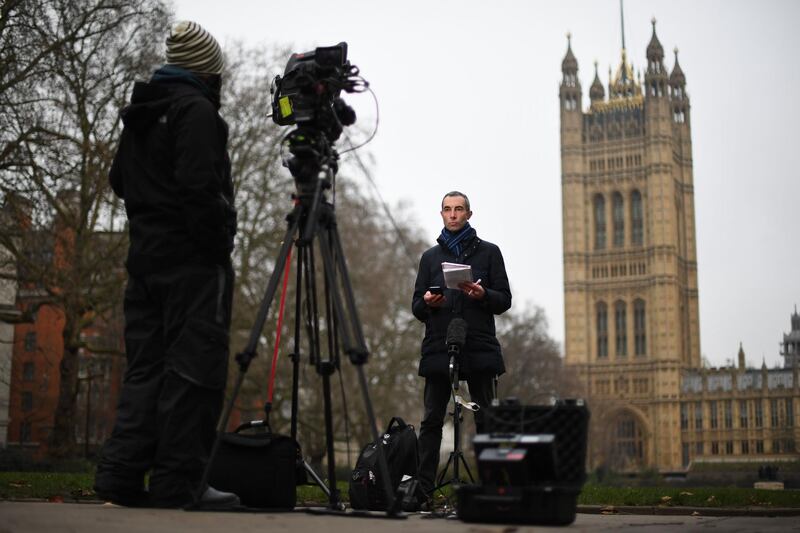 Media do a live broadcast from outside the Houses of Parliament in central London. AFP