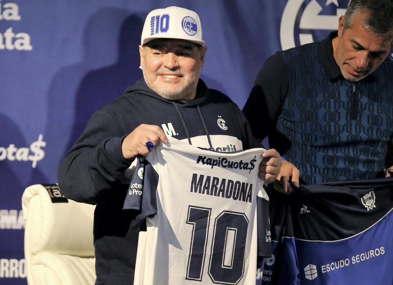 FILE PHOTO: Soccer Football - Argentina - La Plata, Argentina - September 8, 2019   President of Gimnasia y Esgrima Gabriel Pellegrino and Diego Maradona during his presentation as new coach  REUTERS/Agustin Marcarian/File Photo