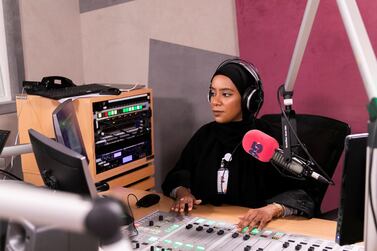 Aisha Al Mazmi speaks on behalf of the nation's youth on her radio show on Sharjah's Pulse 95 Radio. Reem Mohammed / The National