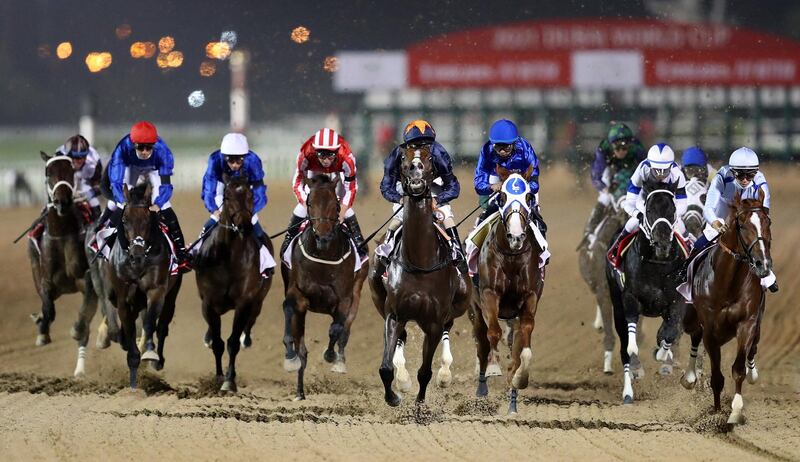 Jockey Luis Saez (centre right, blue cap) guides Mystic Guide to victory in the big race at the Dubai World Cup on Saturday, March 27. EPA