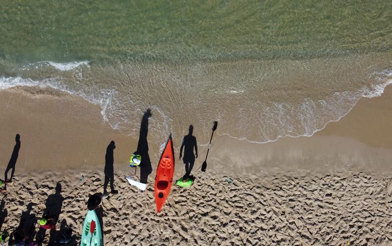 Palestinians take part in a local canoeing championship off the coast of Gaza city.