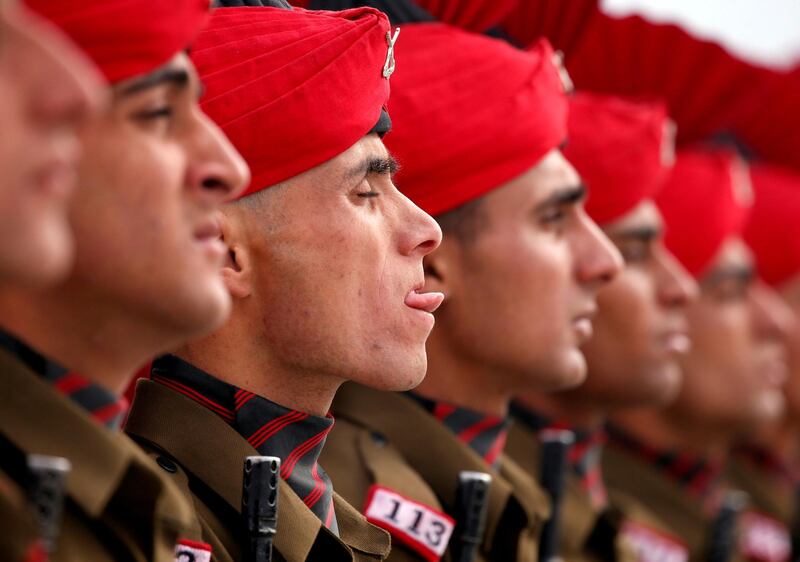 Indian army recruits wearing ceremonial uniform attend their passing out parade in Rangreth, on the outskirts of Srinagar. Danish Ismail / Reuters