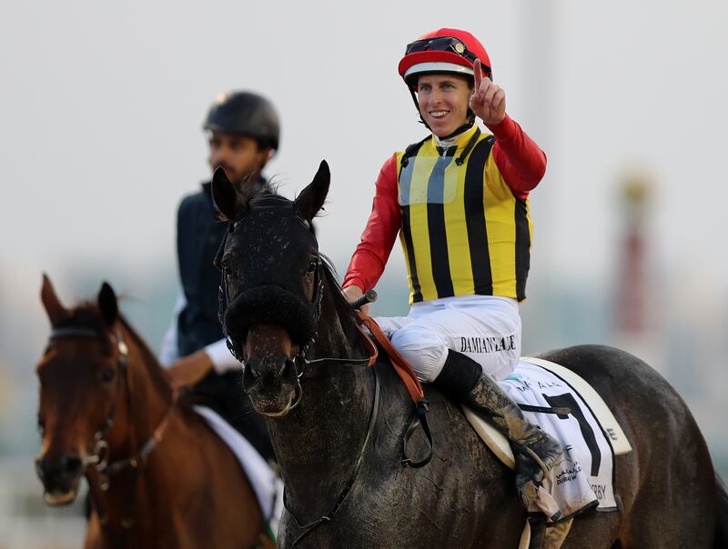Damian Lane celebrates after guiding Crown Pride to victory in the UAE Derby. Chris Whiteoak / The National