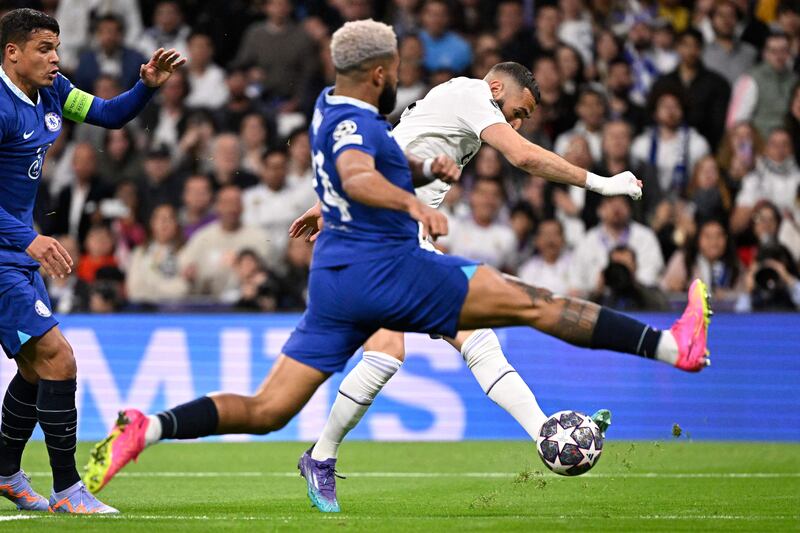 Chelsea's Reece James stretches as he attempts to block a shot from Real Madrid's Karim Benzema. AFP