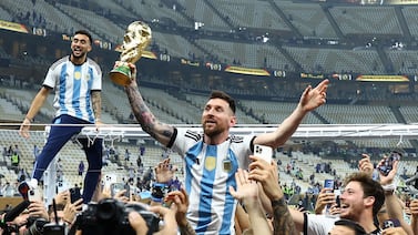 Soccer Football - FIFA World Cup Qatar 2022 - Final - Argentina v France - Lusail Stadium, Lusail, Qatar - December 18, 2022 Argentina's Lionel Messi celebrates with the trophy after winning the World Cup REUTERS/Kai Pfaffenbach     TPX IMAGES OF THE DAY