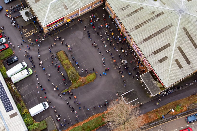 Hundreds of people queue at a vaccination centre in Bristol as the coronavirus booster vaccination programme accelerates to its fastest pace yet. PA