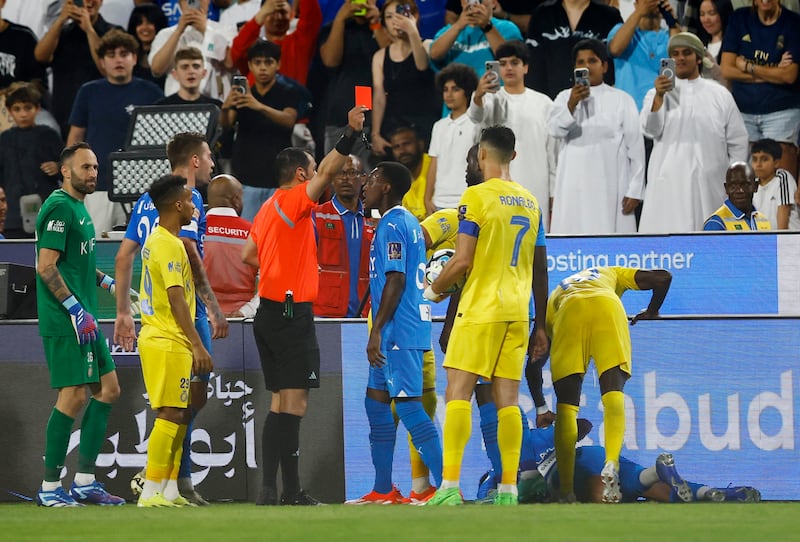 Al Nassr's Cristiano Ronaldo is shown a red card by referee Mohammed Al Hoaish. Reuters