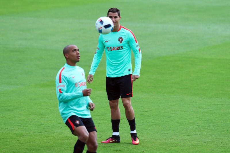 Portugal's Christiano Ronaldo, right, and Joao Mario exercise with the ball during a training session. (AP Photo/Thibault Camus)