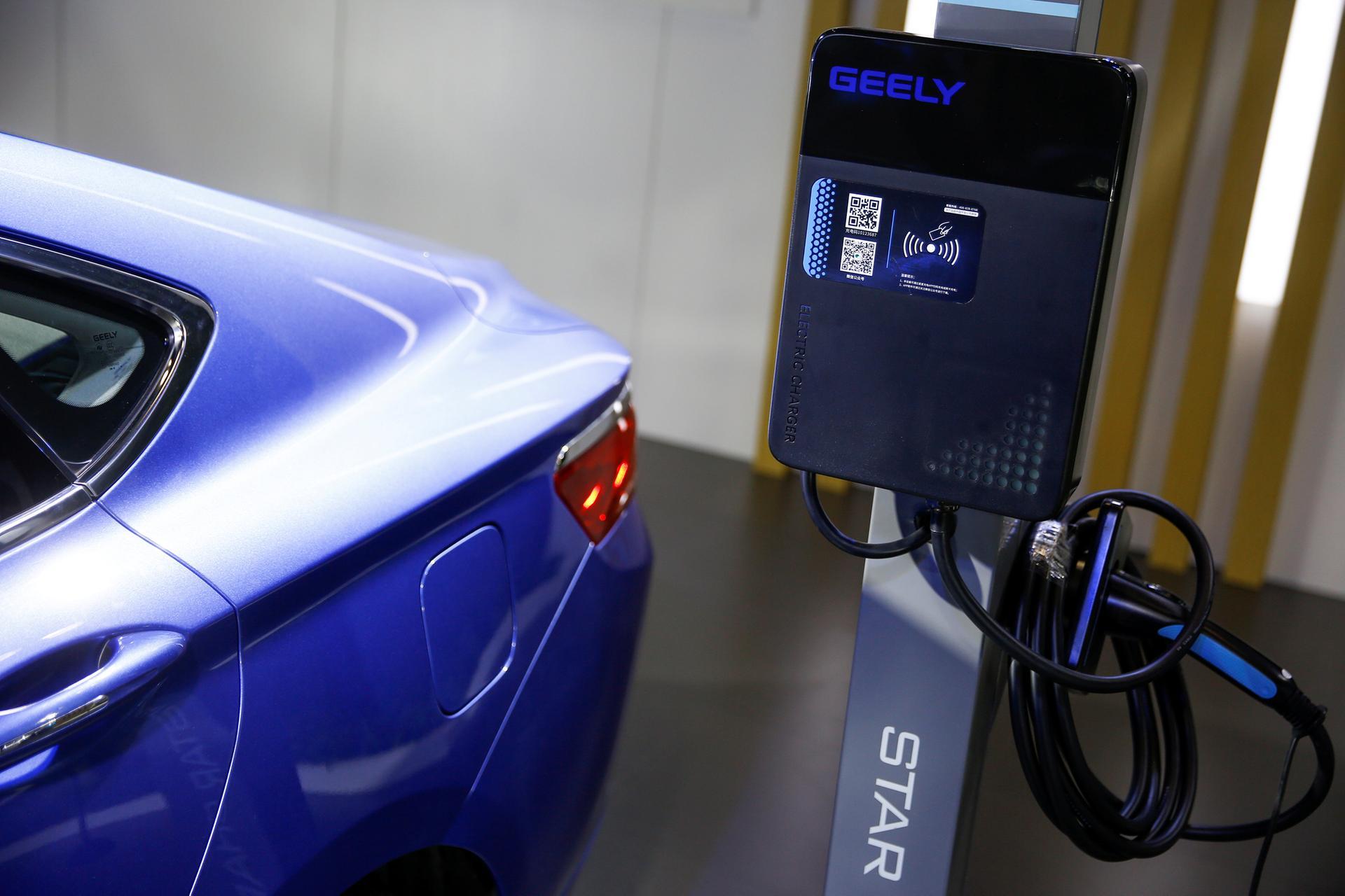 The electric car charging station at the stall of the Geely automobile maker is seen at the IEEV New Energy Vehicles Exhibition in Beijing, China October 18, 2018.  Picture taken October 18, 2018.   REUTERS/Thomas Peter