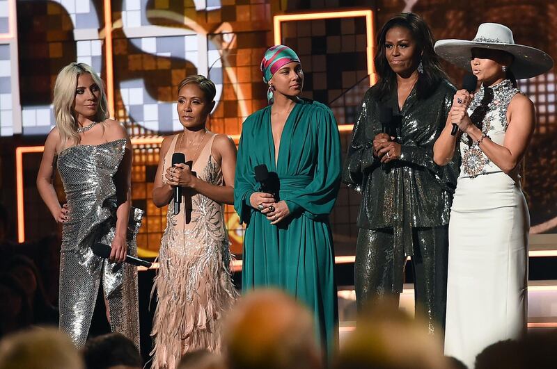 Michelle Obama made a surprise appearance on stage, skipping the red carpet, wearing a wide leg pant suit by New York-based Indian designers Sachin & Babi. Photo: AFP