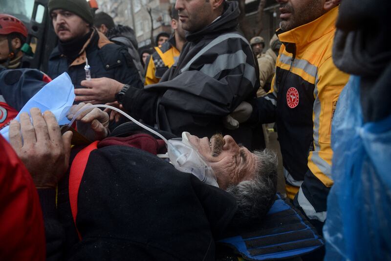 An injured survivor is pulled from the rubble in Diyarbakir. AFP