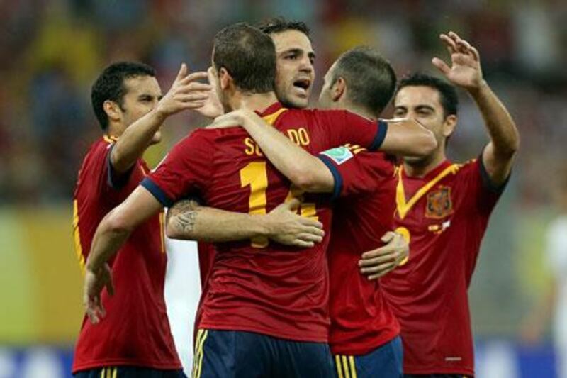 Spain were more organised on the pitch against Uruguay, marshalled by Andres Iniesta, second from right. Jasper Juinen / Getty Images