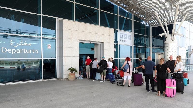 epa07865300 British tourists, flying with Thomas Cook,  queue at the Enfidha International airport, Tunisia, 24 September 2019. More than 600,000 vacation reservations were canceled on 23 September, after Thomas Cook ceased to operate. According to media reports, the company's collapse will see Britain's largest peace time repatriation take place to get stranded customers home.  EPA/MOHAMED MESSARA