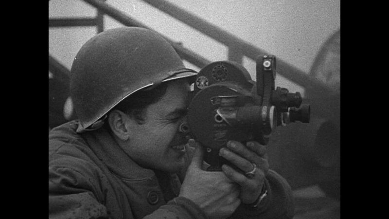 John Ford shooting Second World War propaganda, helped by a US combat cameraman. Courtesy Netflix