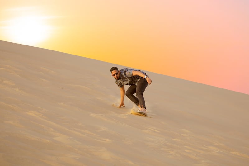 Hamza recommends sandboarding at Al Khatib Desert. Photo: Desert Rose Tourism