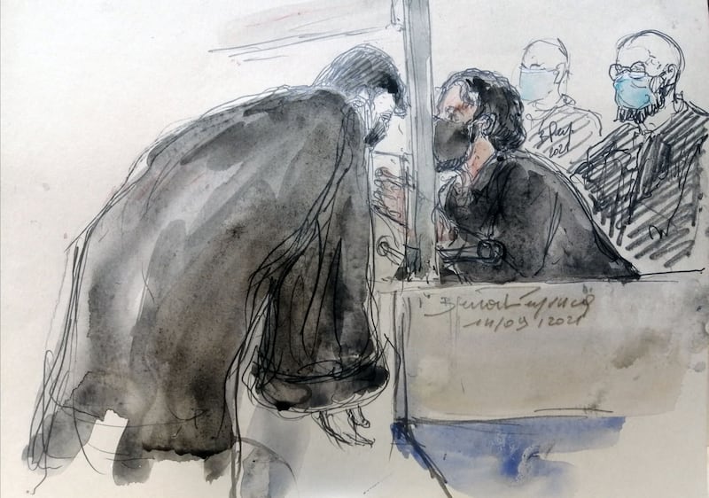 A courtroom artist's sketch of Salah Abdeslam, the prime suspect in the Paris attacks of 2015, speaking to his lawyer. AFP
