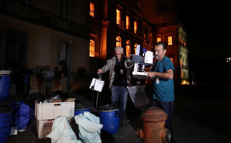 People rescue items during a fire at the National Museum of Brazil in Rio de Janeiro. Reuters