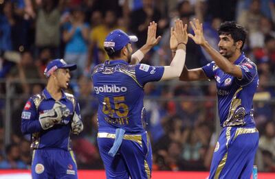 Mumbai Indian's Jasprit Bumrah, right, celebrate the dismissal of King XI Punjab's Marcus Stoinis with teammates, during the VIVO IPL cricket T20 match in Mumbai, India, Wednesday, May 16, 2018. (AP Photo/Rafiq Maqbool)