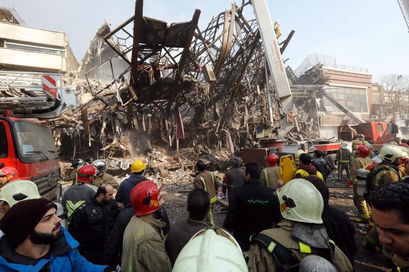 The mangled steel structure of Iran’s oldest high-rise, the Plasco building, after it because of a fire. AFP