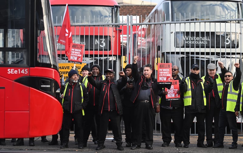 Employees of bus operator Abellio strike outside a depot in London. EPA