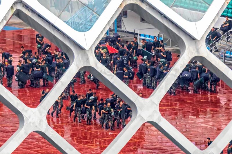 Members of People's Armed Police Force (PAP) practice on the Shenzhen Bay Sports Centre in Shenzhen, Guangdong Province, China.  EPA