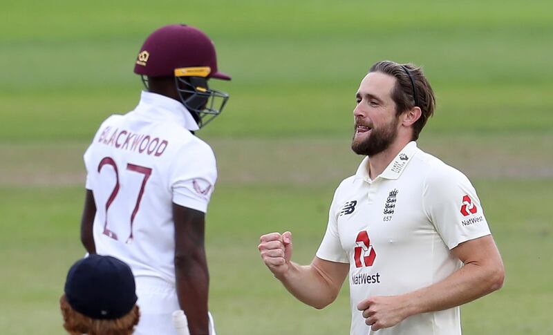 England's Chris Woakes, right, celebrates the dismissal of West Indies' Jermaine Blackwood at Old Trafford in Manchester on Saturday. AP
