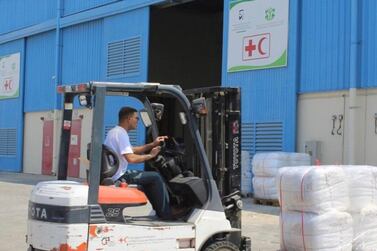 Aid is loaded on to an aircraft at Dubai's International Humanitarian City to be delivered to Sudan, where heavy flooding has displaced thousands of people. Wam