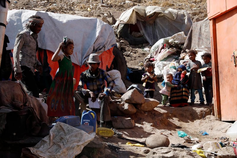Displaced Yemenis sit near their huts at a camp for Internally Displaced Persons (IDPs) on the outskirts of Sana'a, Yemen. EPA