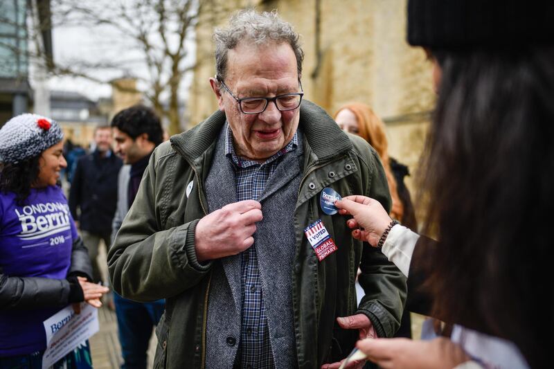 Larry Sanders, brother of US Presidential candidate Bernie Sanders, is given a 'Bernie Abroad' badge after voting in Oxford, England. Getty Images