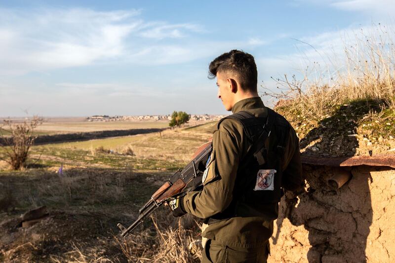 Fighters from a local Christian militia on the front line against Turkish affiliates, near the town of Tell Tamr. December 22, 2019. Thibault Lefébure for The National.  