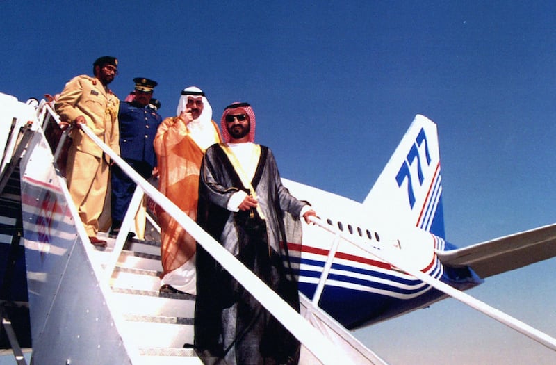 Sheikh Mohammed bin Rashid al-Maktoum, Crown Prince of Dubai and minister of defence for United Arab Emirates (front) descends a boeing 777 after opening the Dubai 1995 airshow November 12. Dubai's fourth international airshow highlights the region's growing significance, with some of the world's leading aircraft makers looking to the United Arab Emirates for a decision on a multi-billion-dollar deal for 80 long range strike planes. The people behind al-Maktoum are unidentified.
**POOR QUALITY DOCUMENT