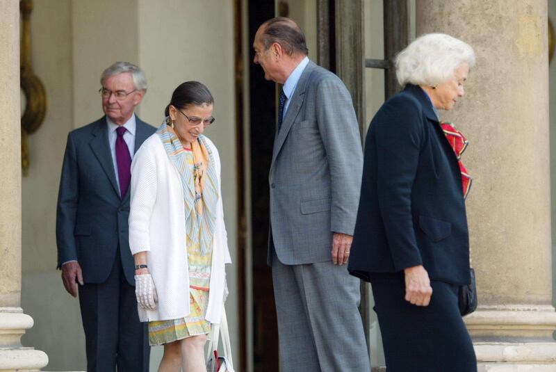 US Supreme Court judges Sandra Day O'Connor, Ruth Bader-Ginsburg and the US Ambassador in Paris Howard Leach stand with French President Jacques Chirac at him at the Elysee Palace on July 8, 2003. AFP