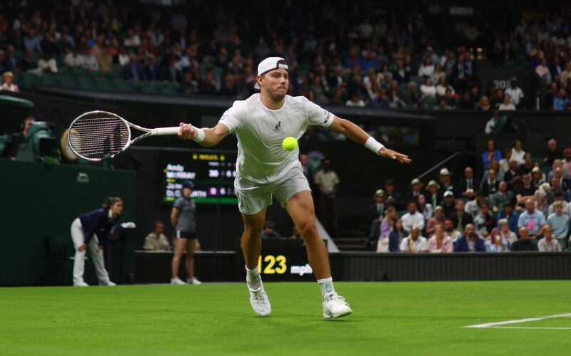 James Duckworth attempts to play a forehand return to Andy Murray. Reuters