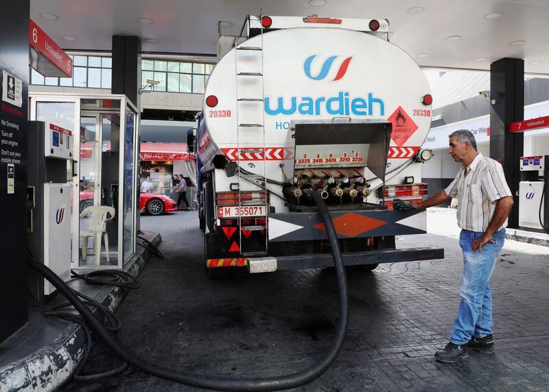 A worker fuels up a storage tank of a gas station in Beirut, Lebanon October 7, 2020. Picture taken October 7, 2020. REUTERS/Mohamed Azakir