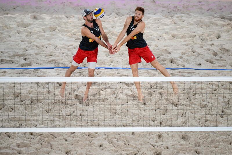 France's Julien Lyneel and Remi Bassereau return the ball to Poland's Michal Bryl and Bartosz Losiak during the volleyball Beach Pro Tour Elite 16, in Paris. AFP